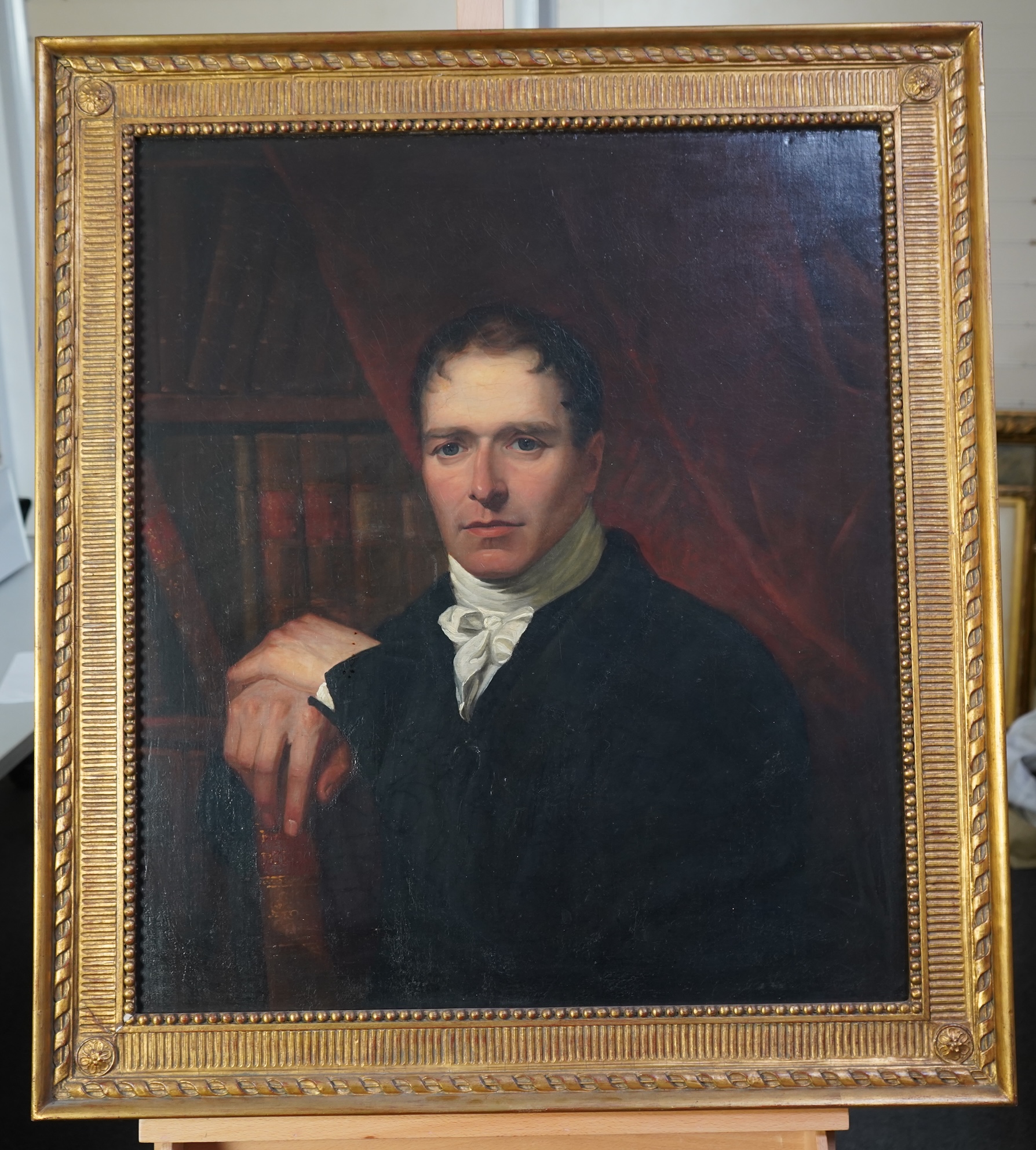 English School, 19th century, A portrait of a scholarly gentleman holding a book